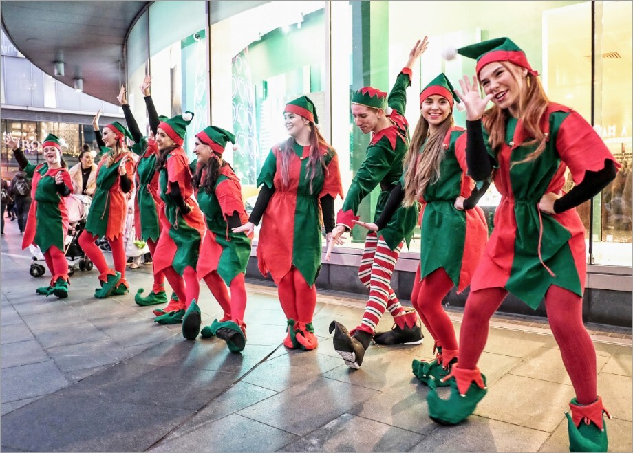A troupe of elves perform for Christmas shoppers at Liverpool One.